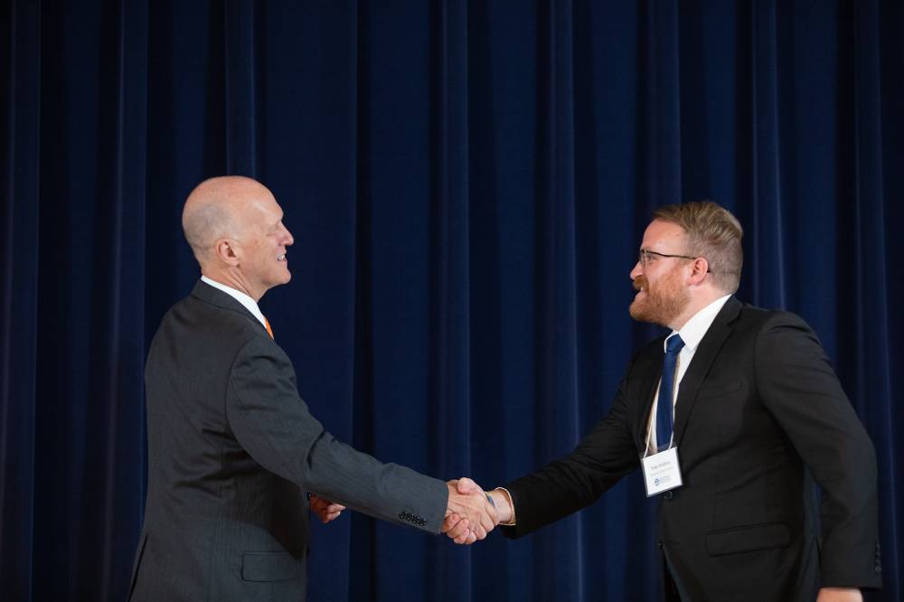 Peter Walblay shaking hands with Dr. Potteiger